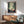 Contemporary poster art reimagining a forest journey with cottage-core aesthetics, set in muted tones of green, cream, and red with minimalist wolf and castle motifs.