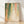 Abstract minimalist poster featuring cascading dots in forest green, coral, and golden yellow tones flowing downward on a cream background, evoking a serene autumn mood.