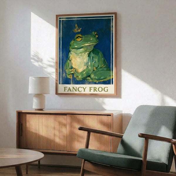 Elaborately styled frog character in vintage folk art aesthetic, rendered in cream, teal, and gold on a framed poster.