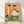 Whimsical retro folk art poster of a goose enjoying wine and cheese at a picnic, rendered in warm peach, coral, and forest green tones with a charming boho aesthetic.