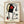 Surrealist abstract poster featuring a stylized female figure in bold red, blue, yellow, and black shapes against a white background, evoking a dreamlike street scene in modernist style.