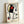 Framed abstract poster depicting a figure in motion through dynamic red, blue, and yellow shapes with black outlines, embodying surrealist dreamlike imagery in modernist composition.