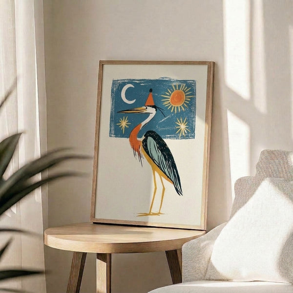 Minimalist framed art print featuring a playful crane in deep teal with an orange party hat, surrounded by celestial elements in warm gold and cream tones.