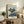 Psychological abstract poster featuring a solitary figure before a mirror, painted in gestural strokes of gray, black, and ochre against white; introspective and existentially charged framed artwork.