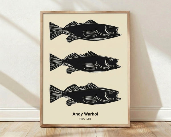 Vibrant pop art poster featuring bright yellow, turquoise, and hot pink fish against a white background, framed on a wall.