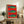 Pop art fish print featuring saturated reds, bright pinks, and orange hues with a modern, playful aesthetic against neutral contrasting tones.
