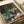 Monet-style spring garden scene with impressionistic flowers in subtle, harmonious color tones, framed poster wall decor.