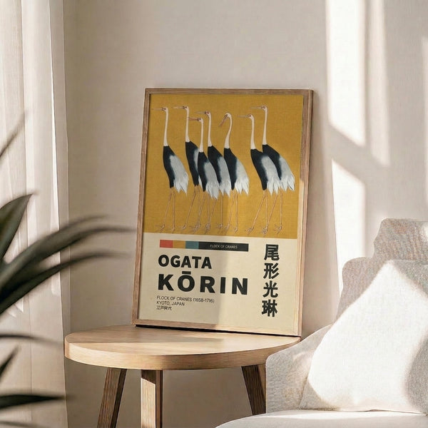 Serene Japanese woodblock poster showing a flock of cranes rendered in sophisticated gold, black, and cream palette, capturing Korin's signature contemplative mood.