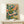 Whimsical vinyl record player poster with mustard gold and cream accents, adorned with flowing botanical elements in a bohemian aesthetic.
