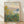 Monet's Flower Beds at Vétheuil framed poster displaying vibrant impressionist garden scene with blooming flowers in warm and cool tones on a wall.