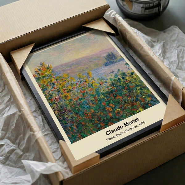 Framed impressionist poster featuring vibrant garden flowers in soft orange, violet, and green tones, evoking a serene and luminous riverside floral scene.