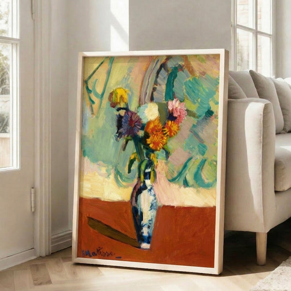 Framed modern floral artwork featuring a striking vase filled with vivid, loosely rendered blooms in a sophisticated color harmony of contrasting hues.