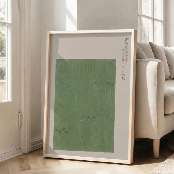 Japanese-inspired wall art showing birds in flight over a serene temple scene, with warm cream and muted green tones in a simple, elegant style.