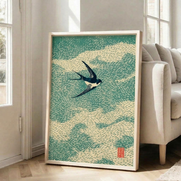 Zen-inspired wall art showing a swallow gliding above rolling waves, combining contemplative Japanese artistic traditions with a soft sage and teal color palette.