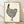 Charming folk art print of a polka dot rooster in cream, black, and dark red, displayed as a framed linocut-style poster on a wall.