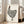 Japandi wall art depicting a charming polka dot hen in linocut aesthetic, combining cream backgrounds with bold dark lines and warm brown tones.