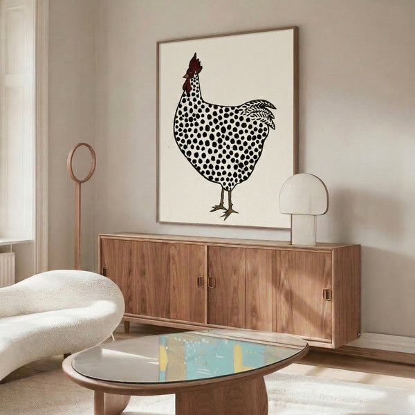 Charming spotted rooster artwork in minimalist linocut style, blending rustic folk aesthetics with cream, dark red, and brown earthy tones on a wall.