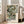 Elegant Japanese botanical wall art depicting flowering plants and forest foliage with refined linework and a sophisticated cream and forest green palette.