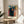 Abstract life stages artwork with introspective figures rendered in soft gold, green, and blue, capturing mood of quiet reflection.