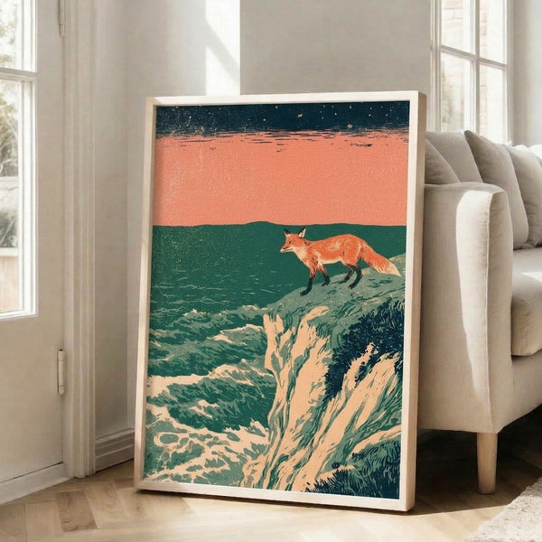 Framed poster of a solitary fox silhouetted against a cream and gold twilight sky, gazing toward a teal ocean below, rendered in the ethereal style of traditional Japanese woodblock prints with warm rust and charcoal tones.