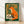 Retro folk art poster of an orange fox holding a steaming coffee cup, rendered in vintage woodland style with forest green and cream tones, evoking a cozy, nostalgic mood.
