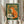 Whimsical vintage-inspired print featuring a charming fox with a coffee mug surrounded by earthy forest hues and folk art details in warm orange and green.