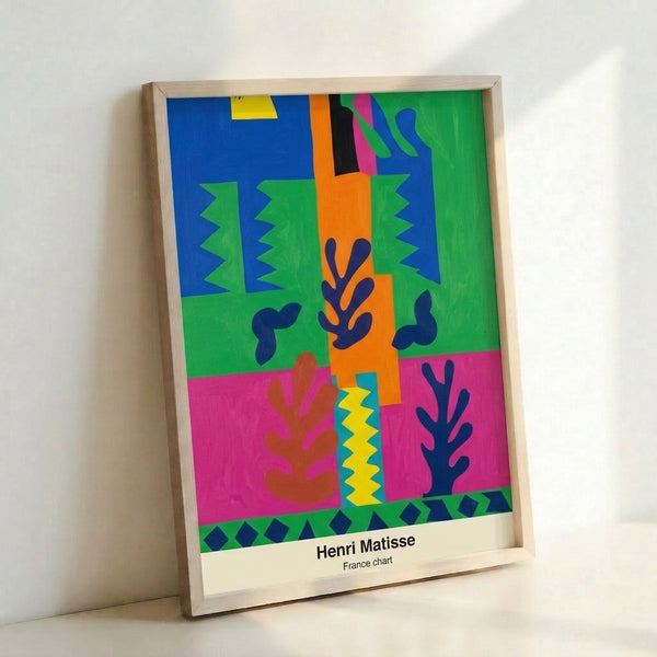 Minimalist wall art displaying organic abstract forms in cheerful warm and cool tones—orange, blue, yellow, and green—against a clean white background with a modern cut-out aesthetic.