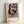 Abstract portrait poster featuring a warped human figure in lavender and ochre hues, capturing an intense and existentially disturbing aesthetic.