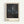Framed modern art print depicting a faceless seated figure in muted grays and blacks, conveying psychological tension through gestural, abstracted brushwork.