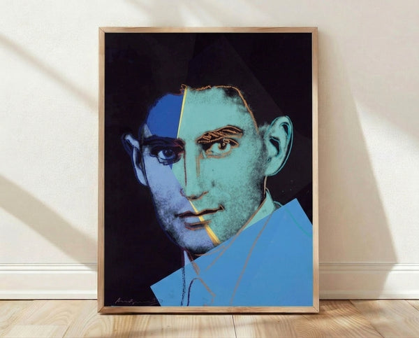 Pop art style portrait of Franz Kafka in vibrant colors, part of Andy Warhol's Ten Portraits of Jews of the Twentieth Century series, framed poster on wall.