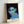 Modern minimalist portrait print in muted green and blue palette with black accents, capturing an introspective and intellectual aesthetic typical of pop art.