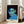 Contemporary pop art style portrait in cool, muted tones of green and blue with striking black lines, evoking a serious and thoughtful mood.