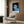 Bold pop art portrait rendering a man's face in muted green and blue hues with black definition, striking an intellectually introspective and starkly modern aesthetic.
