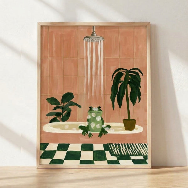 Whimsical framed poster of a relaxed frog soaking in a bubble bath surrounded by potted plants and terracotta tiles, rendered in soft sage green, cream, and olive tones in modern minimalist style.