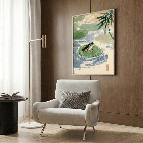 Japanese woodblock-style framed poster showing a tranquil frog seated on a lily pad surrounded by water, rendered in gentle greens, creams, and pale blue hues.
