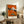 Framed poster with nightmarish abstract imagery in deep reds, blacks, and ochre hues; a surreal, unsettling study in psychological turmoil and raw expression.