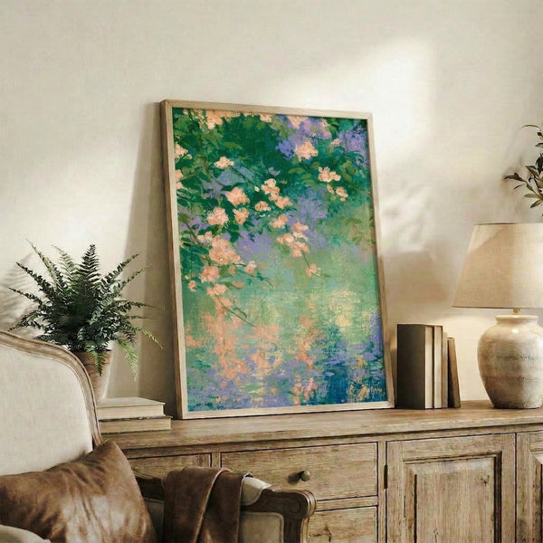 Impressionist watercolor art print depicting peachy blossoms floating above a garden pond surrounded by forest green leaves and cream accents, evoking a contemplative mood.