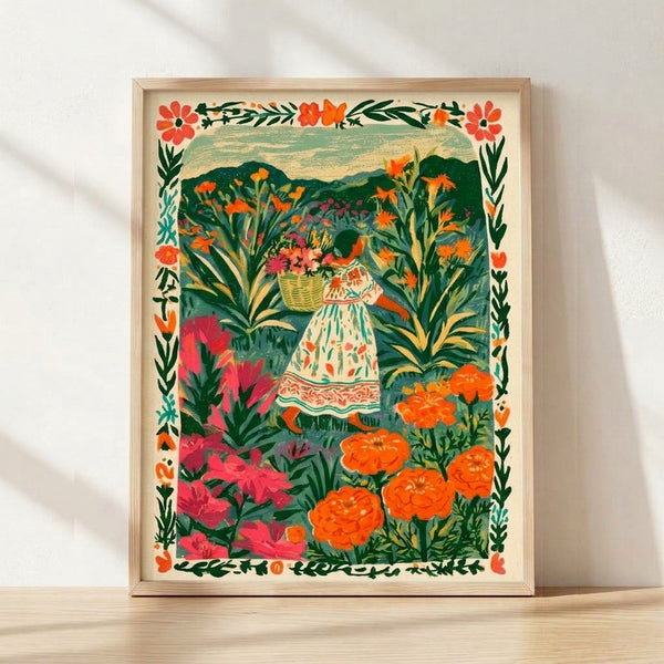 Framed folk art print depicting a woman in a colorful dress gathering flowers into a basket among lush garden plants, rendered in whimsical cottagecore style with cream, forest green, coral, and magenta tones.