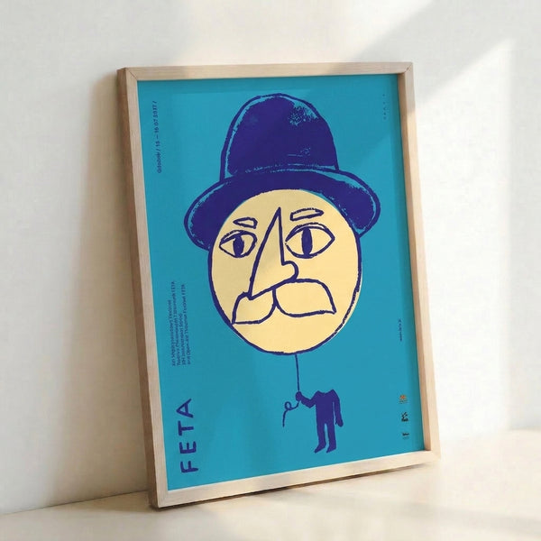 Vintage Gdansk theater poster showcasing a whimsical geometric face wearing a bowler hat against soft turquoise and pale yellow background.