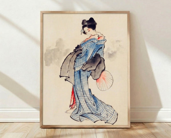 Framed vintage Japanese woodblock print depicting a graceful geisha in a blue checkered kimono holding a fan, rendered in cream, coral pink, and black tones with serene elegance.