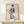 Graceful figure study in vintage Japanese woodblock technique: a geisha in blue checkered robes holding a fan, composed in cream, coral, and slate gray with sophisticated restraint.