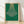 Framed Bauhaus-style poster featuring a geometric chandelier in forest green and gold on a cream background, embodying minimalist elegance and sophisticated design.