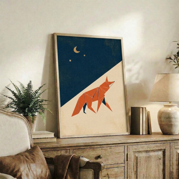 Serene wabi sabi illustration of an origami-style fox gazing up at a gold crescent moon against a teal night sky with scattered stars, displayed as a framed poster.