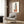 Minimalist architectural poster with stacked blocks in soft sage green, cream, and charcoal, arranged in a balanced, structured arrangement.