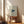 Serene wall art poster displaying a stylized origami whale in navy against cream and ochre water layers, embodying minimalist ocean tranquility and wabi-sabi design.