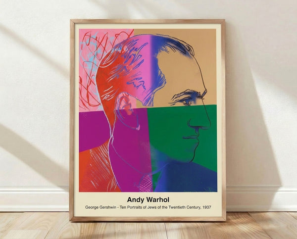 Pop art portrait of a man's face in bold black, cream, and accent color blocking, rendered in minimalist style on a framed poster.