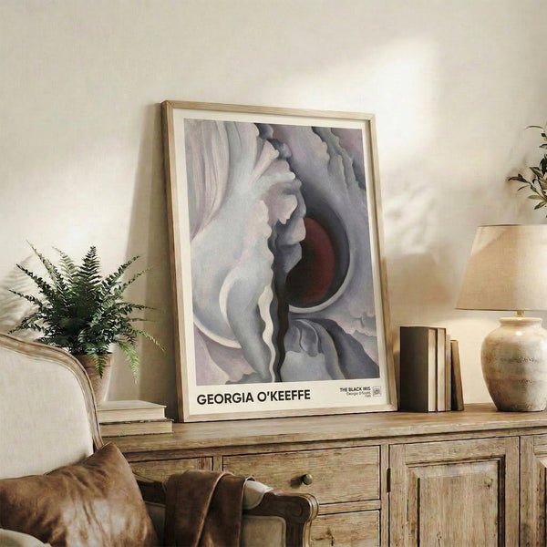 Abstract floral poster of a dark iris with sensual petal forms in burgundy and cool gray tones, wall-mounted modern art.