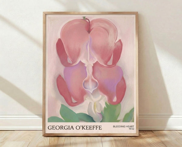 Soft pink and lavender bleeding heart flower with delicate petals and sage green leaves in Art Nouveau style, framed poster on wall.