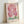 Serene close-up of bleeding heart flower petals in soft pink and lavender with contemplative, sensual quality in vintage botanical art style.