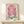 Delicate bleeding heart plant with graceful drooping petals in warm pink and sage green, Art Nouveau poster displayed framed on interior wall.